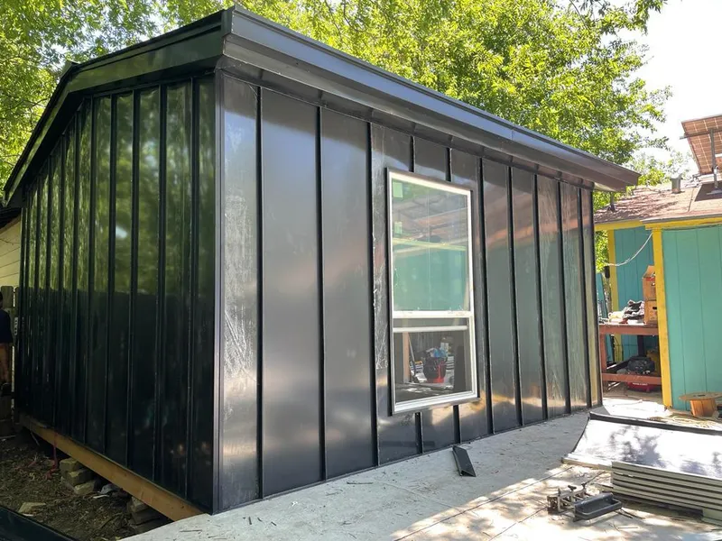 Black standing seam metal wall panels for Roof Inspection in Fort Lupton